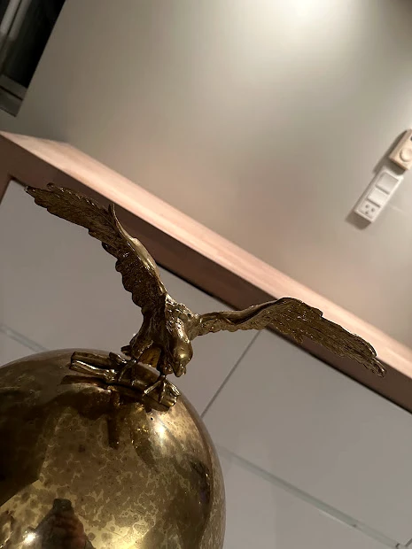 Full eagle finial above the patinated dome of Nicolaj’s 1995 Brasilia espresso machine